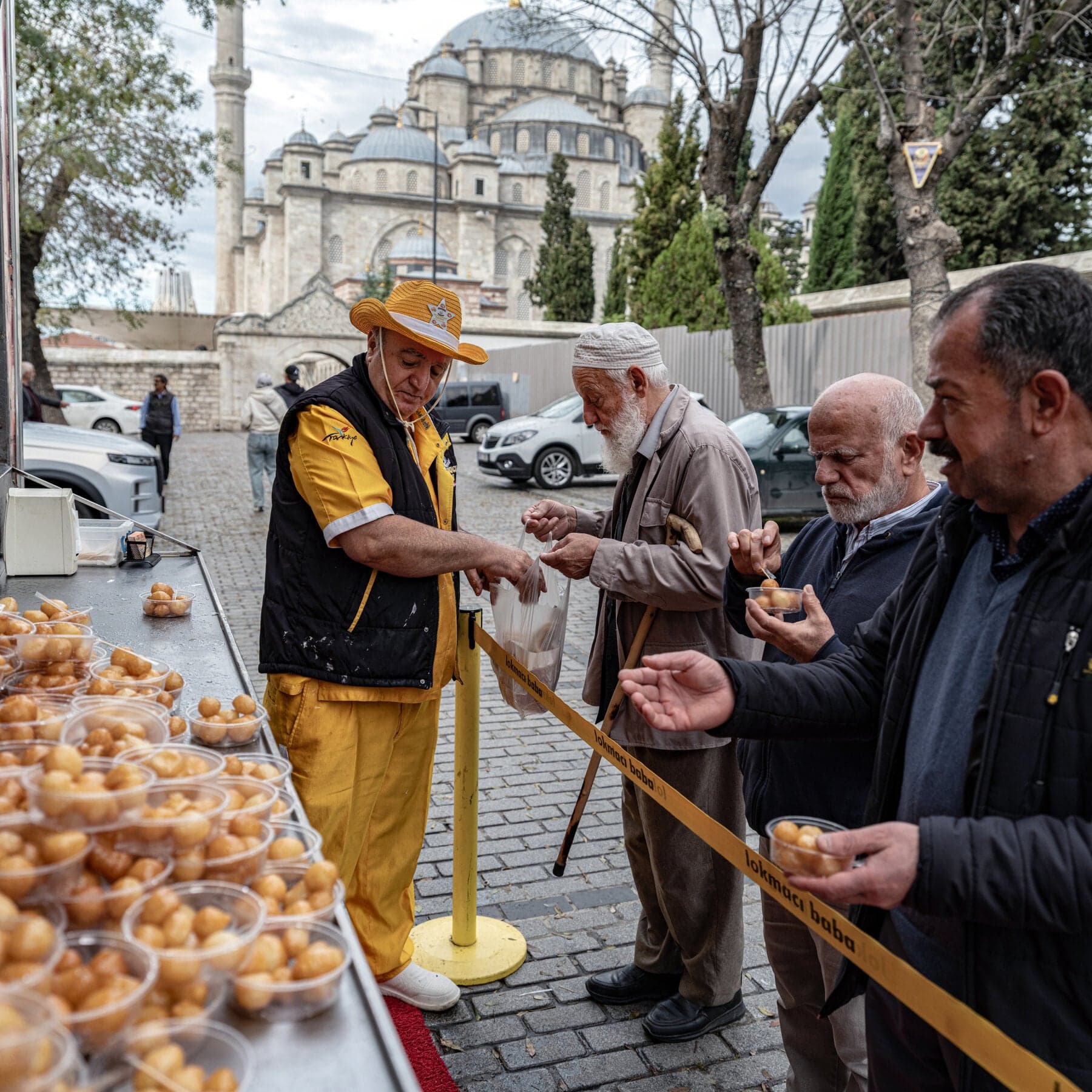 Turkish Confectioner Hands Out Doughnuts to Honor the Dead