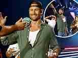 Glen Powell chugs a beer on stage at Luke Combs concert with Twisters co-stars Daisy Edgar-Jones and Anthony Ramos