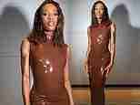 AJ Odudu sends temperatures soaring in a skin-tight latex dress with racy thigh-high split as she hosts Celebrity Big Brother's latest live eviction