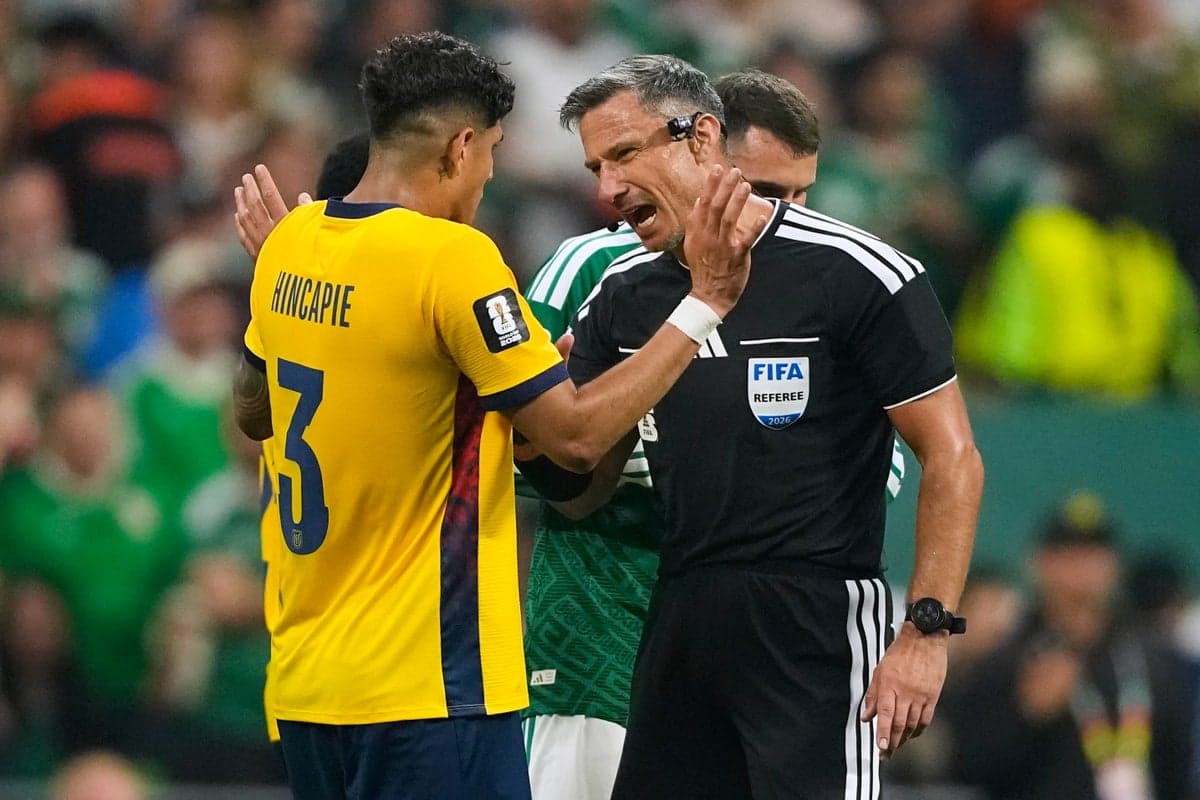 Why are red cards given to World Cup players covering their mouths? 