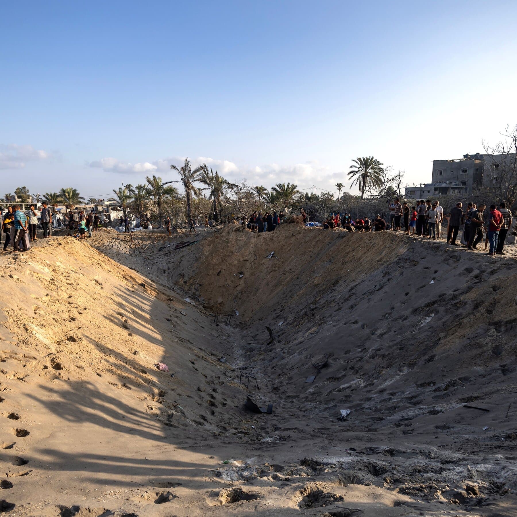 Middle East Crisis: Rescuers Struggle to Reach Victims After Israel Targets Militants in Tent Camp