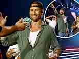 Glen Powell chugs a beer on stage at Luke Combs concert with Twisters co-stars Daisy Edgar-Jones and Anthony Ramos